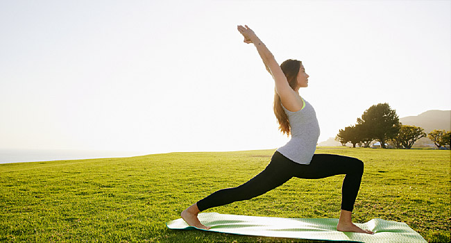 woman doing yoga outdoors